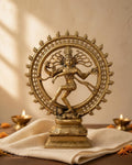 Styled image: Nataraja Brass Idol on ivory handloom with Diwali diyas