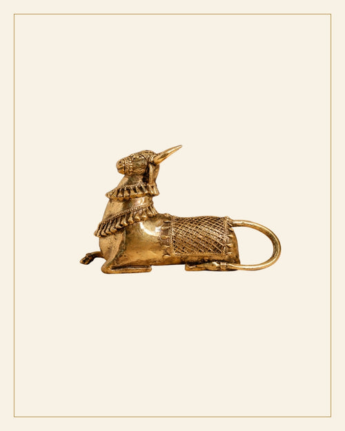 Handcrafted Brass Sitting Nandi Idol – Traditional Bhareva Bell Metal Sacred Bull Show piece — Saptadhārā