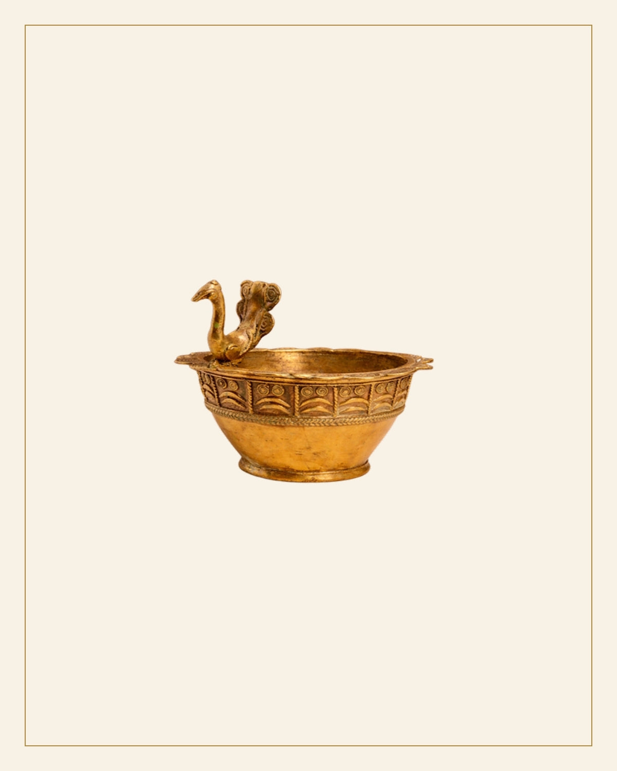 Handcrafted Brass Urli Bowl with Ornamental Animal Face Motif — Saptadhārā