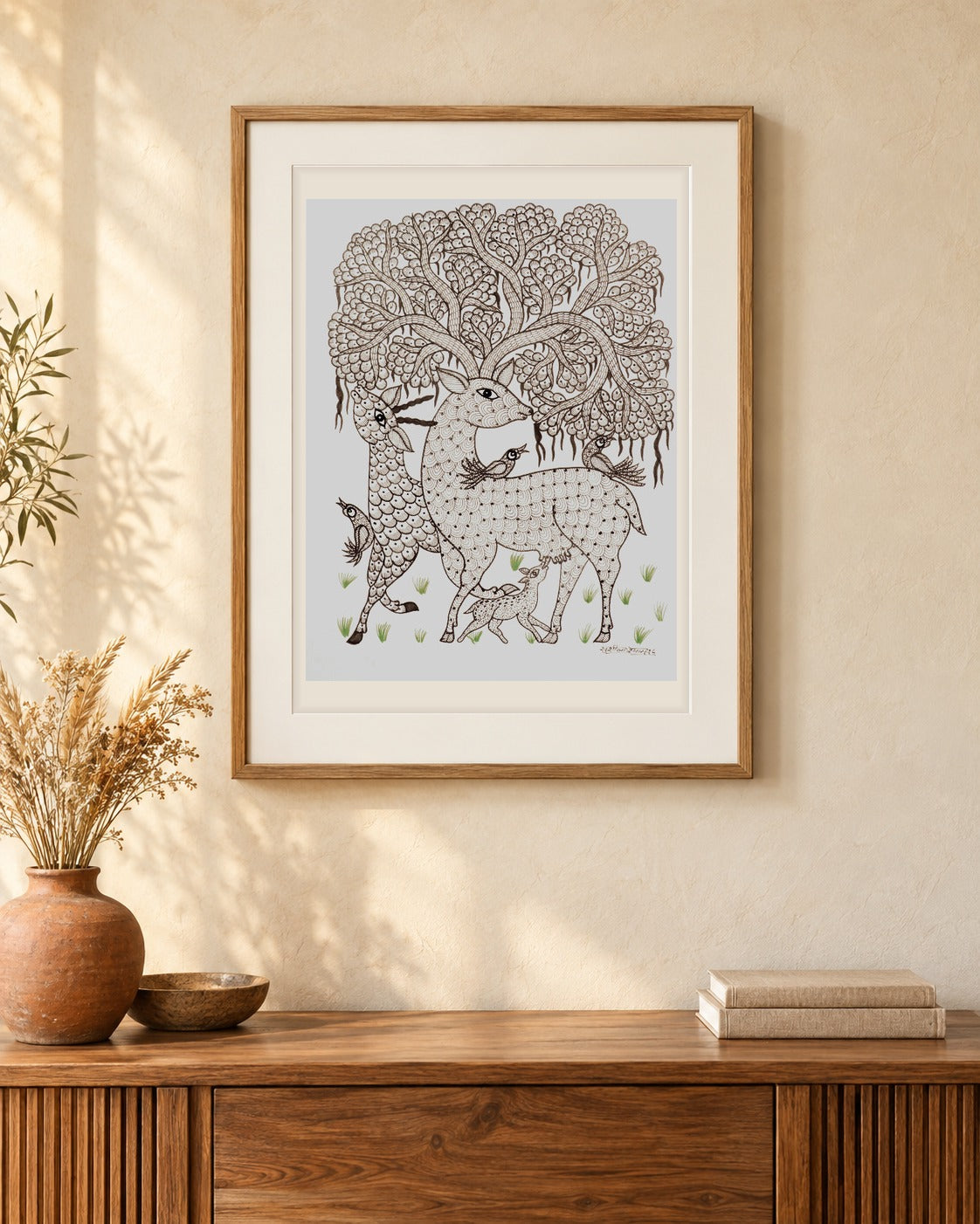 Original Gond painting shown framed on a wall