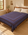 Hand block printed bedsheet styled in a bedroom