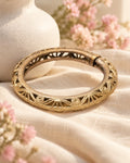 Styled image: Sona Bell Metal Floral Kada on linen