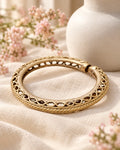 Styled image: Sona Bell Metal Open Cuff Kada on linen