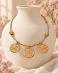 Styled image: Sona Bell Metal Coin Necklace Set on a white vase