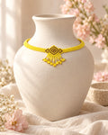Styled image: Haldi Geometric Beaded Choker Necklace Set on a white vase