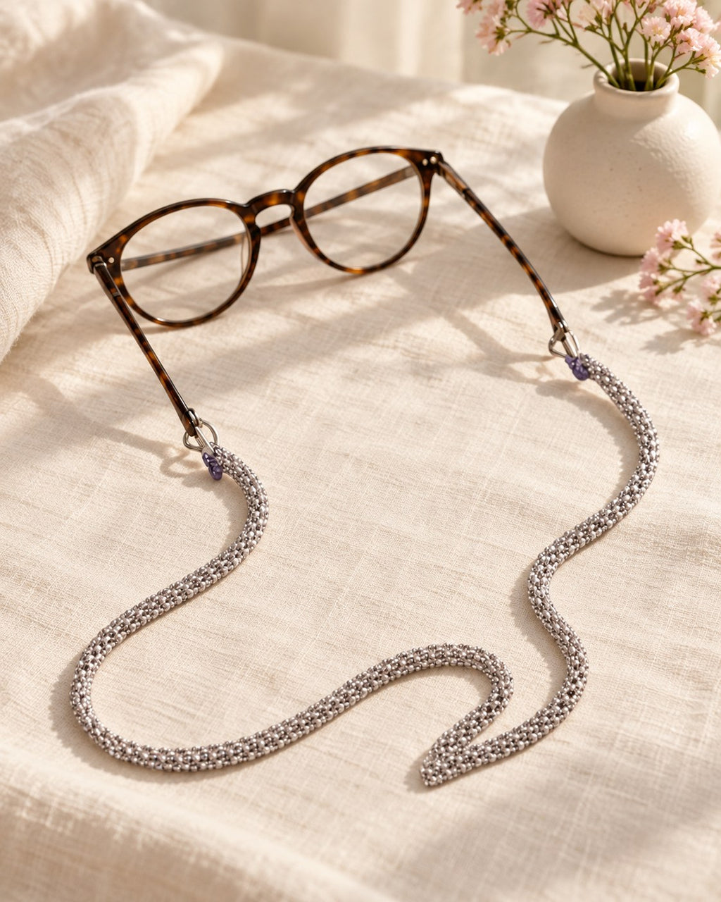 Styled photograph of the beaded eyeglass chain