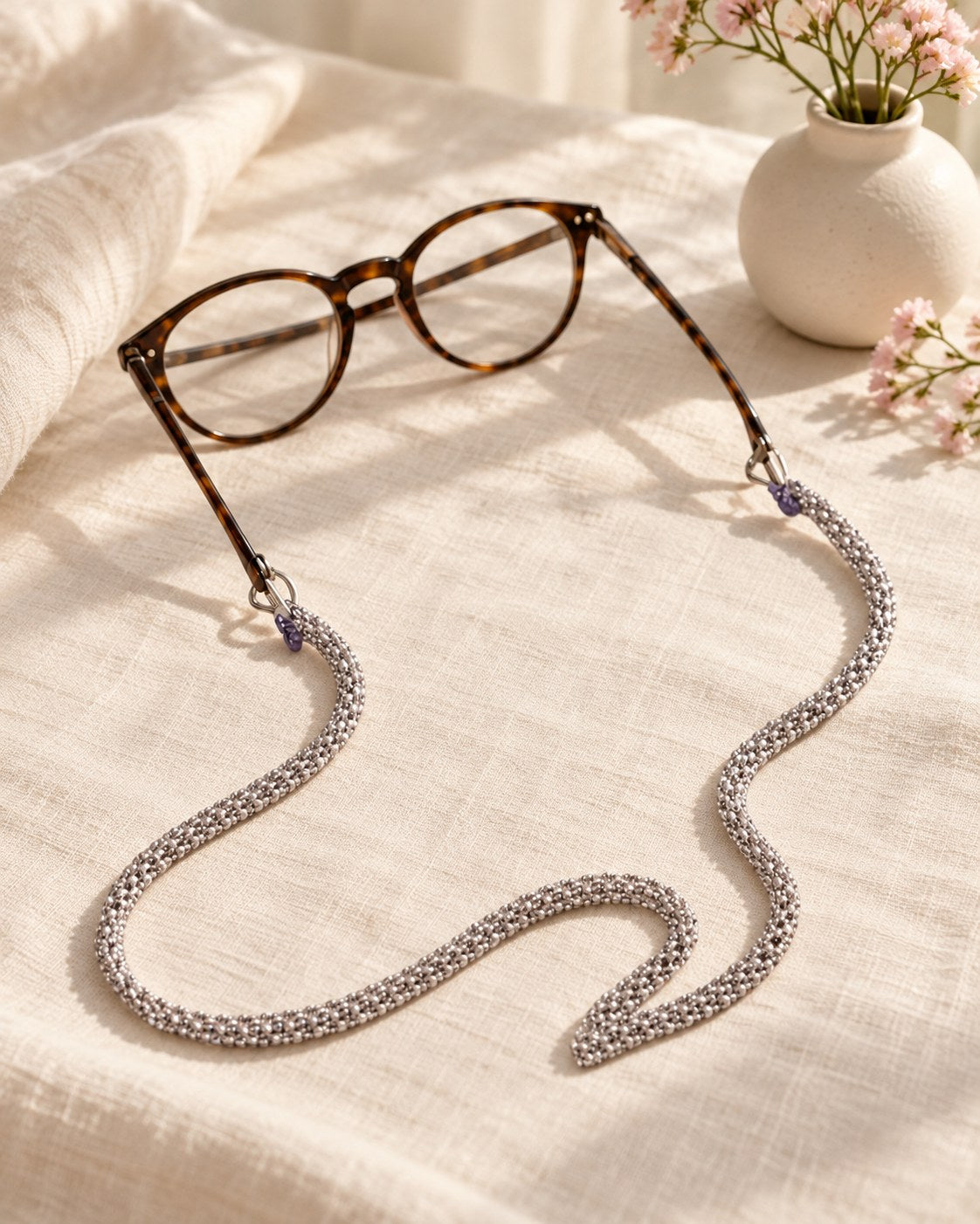 Styled photograph of the beaded eyeglass chain