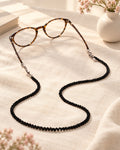 Styled photograph of the beaded eyeglass chain