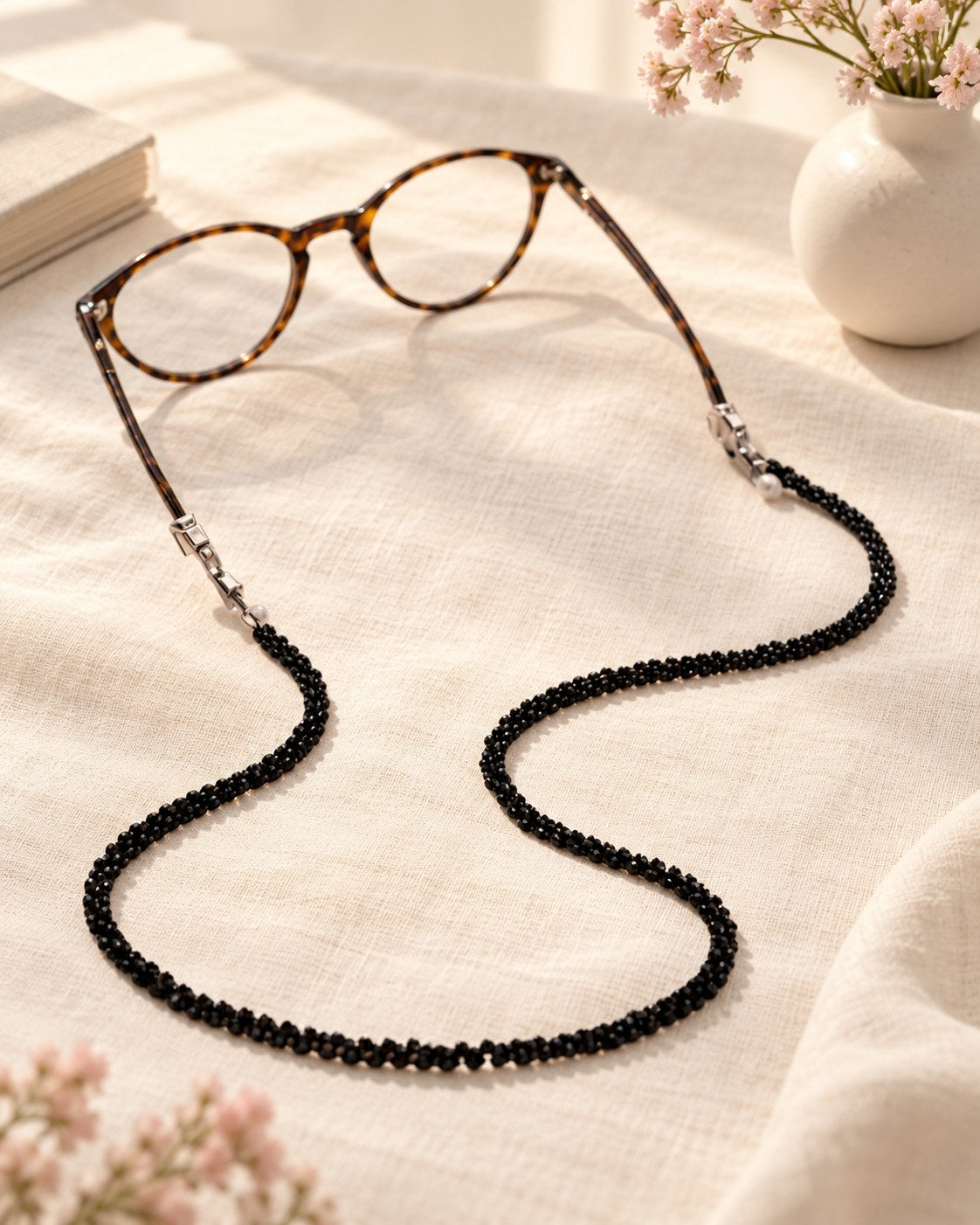 Styled photograph of the beaded eyeglass chain