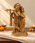 Styled image: Radha Krishna Brass Idol, Golden Finish, on ivory handloom with Diwali diyas